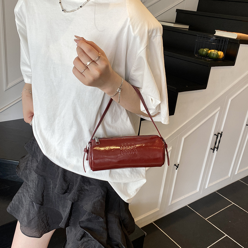 Spring soft cowhide one-shoulder pen holder underarm bag small hand-carrying cylinder women's bag